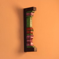 Hand Painted Pillar Wall Bracket Styled on Wall Extreme close-up of the carved petal-shaped bands in pink, red and purple, with ridged layers and painted green edging.