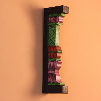 Extreme close-up of the carved petal-shaped bands in pink, red and purple, with ridged layers and painted green edging.
