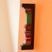 Hand Painted Pillar Wall Bracket Styled on Wall Extreme close-up of the carved petal-shaped bands in pink, red and purple, with ridged layers and painted green edging.