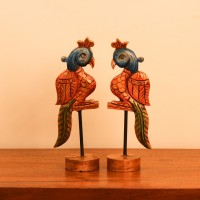 Handcrafted Bird Table Decor on Iron Stand Artistic wooden bird figurine mounted on an iron stand with handcrafted detailing and vibrant ethnic-inspired colors.