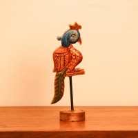 Handcrafted Bird Table Decor on Iron Stand Artistic wooden bird figurine mounted on an iron stand with handcrafted detailing and vibrant ethnic-inspired colors.