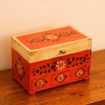 A handcrafted wooden organiser box featuring hand painted floral detailing, three small drawers, and a spacious storage compartment in warm orange and beige tones.