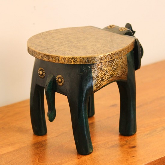 Elephant Stool – Green with Embossed Brass, Side View Side view of the elephant stool, showing the raised trunk, the brass-embossed seat and the brass side panel set between the dark green legs.