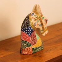 Hand Painted Folk Motif Horse Head Decor Styled on Table Hand-painted folk motif wooden horse head with a cream face placed on a wooden table as a colourful tabletop accent.