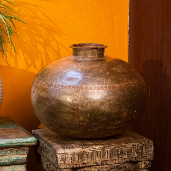 Antique rustic iron pot planter – vintage metal planter front view Antique rustic iron pot planter – vintage metal planter front view