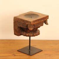 Vintage Carved Wooden Candle Holder with Stand – Styled on Wall Vintage carved wooden candle holder on iron stand styled on a console against a warm wall