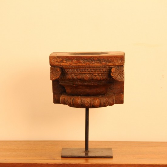 Vintage Carved Wooden Candle Holder with Stand – Styled on Wall Vintage carved wooden candle holder on iron stand styled on a console against a warm wall