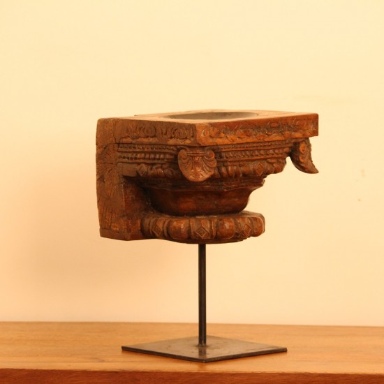 Vintage Carved Wooden Candle Holder with Stand – Styled on Wall Vintage carved wooden candle holder on iron stand styled on a console against a warm wall