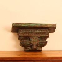 Antique Wooden Wall Shelf – Green Genuine antique wooden wall shelf with a weathered green-toned top plank set on a carved pedestal base with a floral medallion motif.