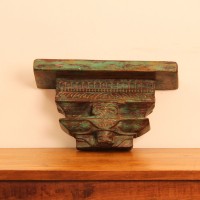 Antique Wooden Wall Shelf – Green Genuine antique wooden wall shelf with a weathered green-toned top plank set on a carved pedestal base with a floral medallion motif.