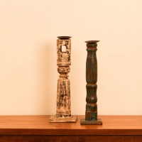 Repurposed Wooden Pillar Candle Stand – Distressed Green Candle stand crafted from a repurposed antique bed leg, turned into a slender pillar form with a distressed green finish and a black metal candle plate on top.