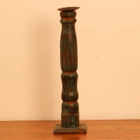Repurposed Wooden Pillar Candle Stand – Distressed Green Candle stand crafted from a repurposed antique bed leg, turned into a slender pillar form with a distressed green finish and a black metal candle plate on top.