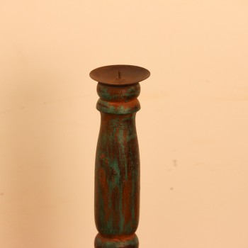 Repurposed Wooden Pillar Candle Stand – Distressed Green Candle stand crafted from a repurposed antique bed leg, turned into a slender pillar form with a distressed green finish and a black metal candle plate on top.