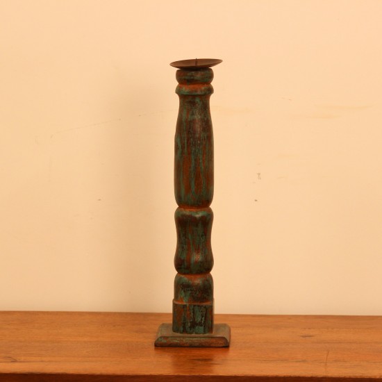 Repurposed Wooden Pillar Candle Stand – Distressed Green Candle stand crafted from a repurposed antique bed leg, turned into a slender pillar form with a distressed green finish and a black metal candle plate on top.