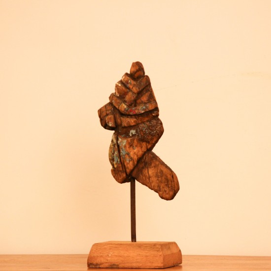Vintage Carved Wooden Fragment on Stand – Extreme Close-Up Extreme close-up of aged wood texture and traces of old paint on the carving
