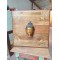 Brass Buddha on Wooden Panel