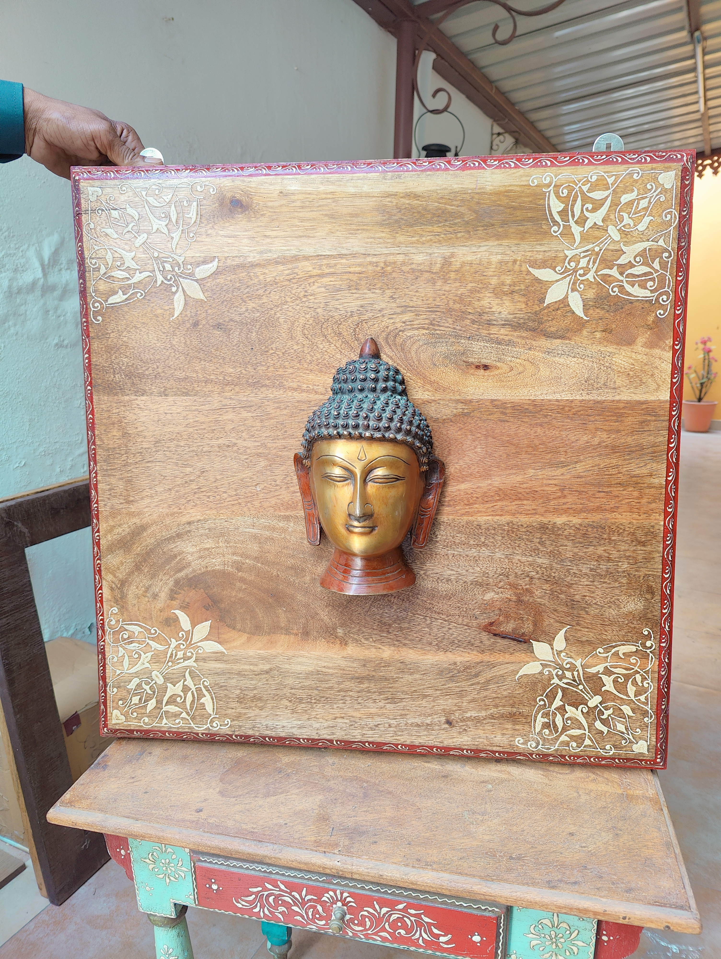 Brass Buddha on Wooden Panel Brass Buddha on Wooden Panel